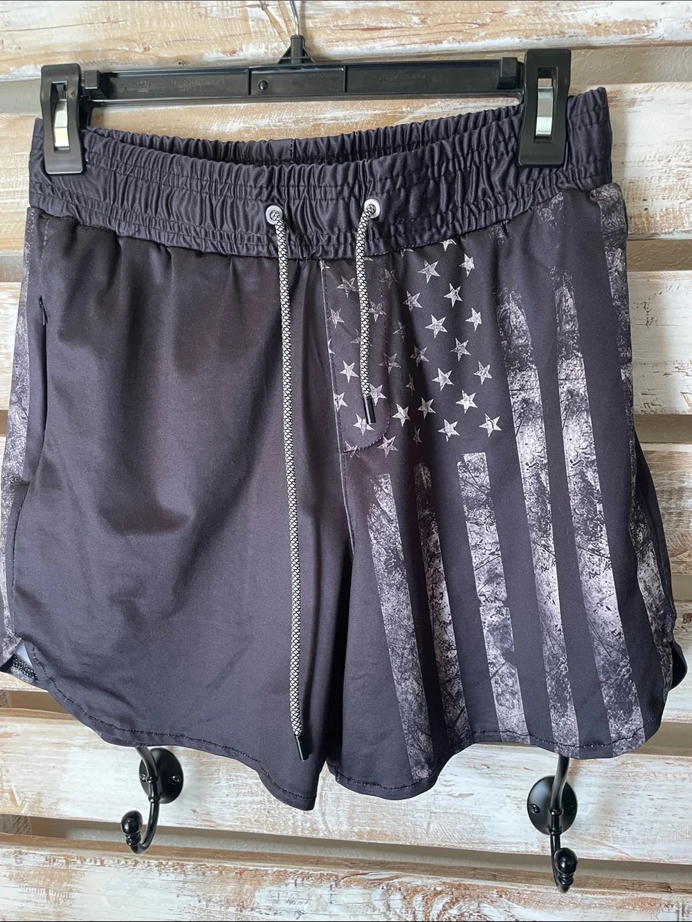 black tactical-style swim trunks by FT Fenteng | faded American flag has pockets